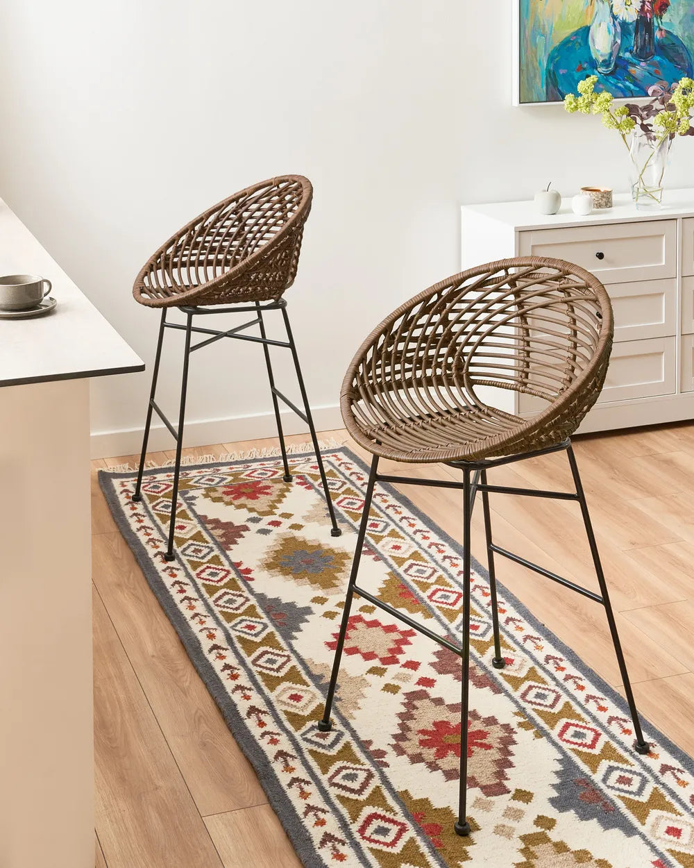 Brown rattan chairs with sturdy iron frames