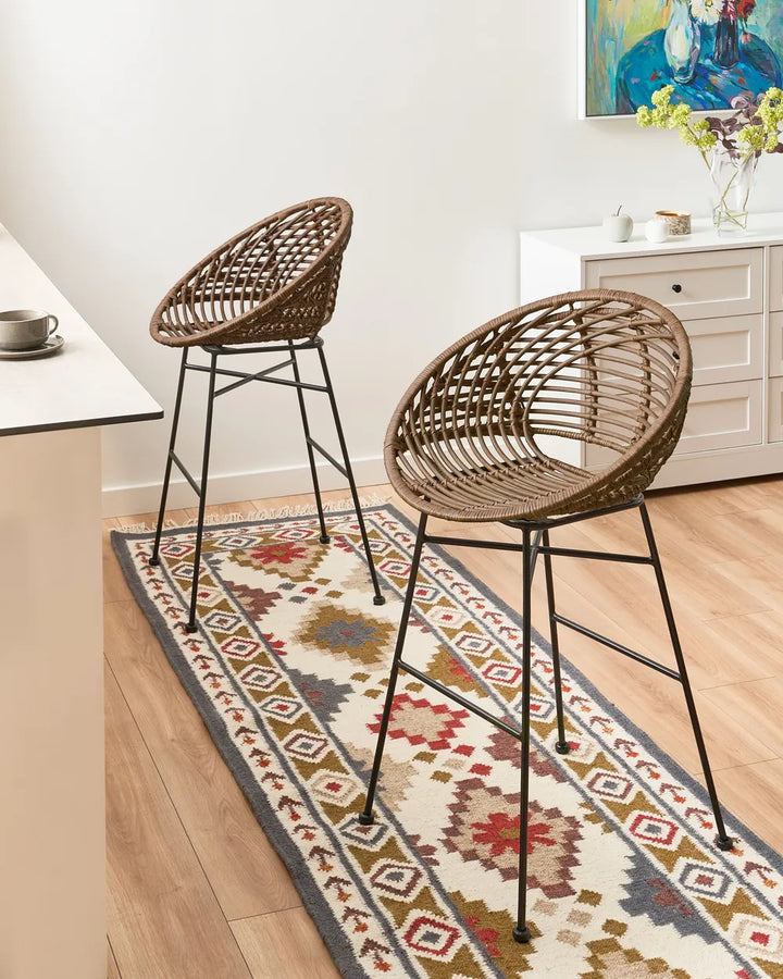 Brown rattan chairs with sturdy iron frames