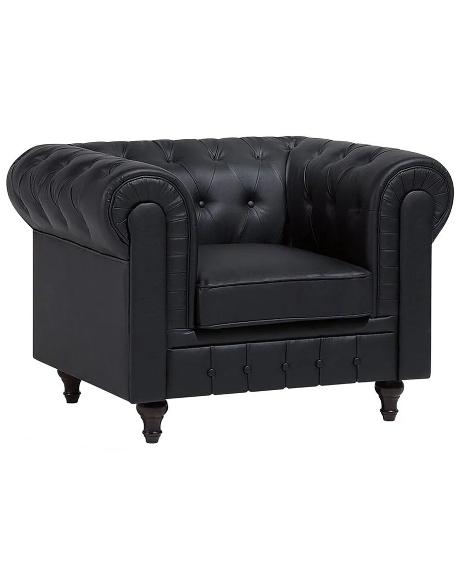 A classic Chesterfield armchair in black leather, featuring deep button tufting on the backrest and sides, rolled arms, a thick seat cushion, and dark turned legs, shown against a plain white background.