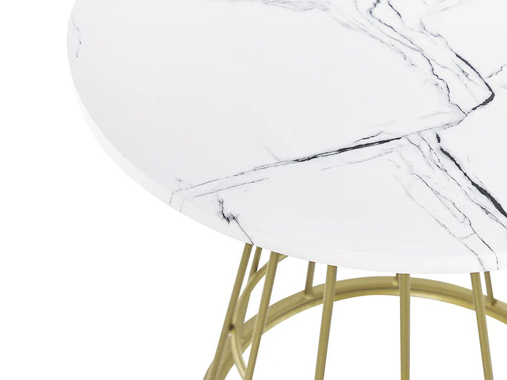 Close-up of a round white marble tabletop with black veining and a gold metal wire base on a white background.
