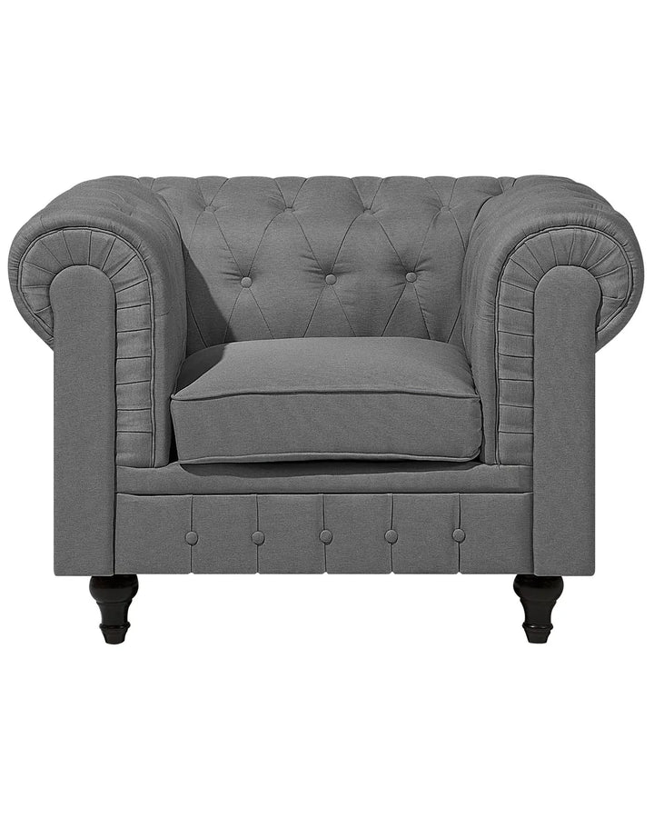 Gray tufted armchair on a white background