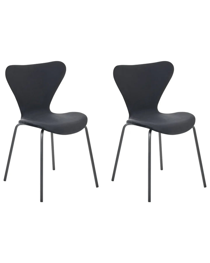 Two modern black dining chairs with sculptural curved seats and slim metal legs, shown side by side on a plain white background.
