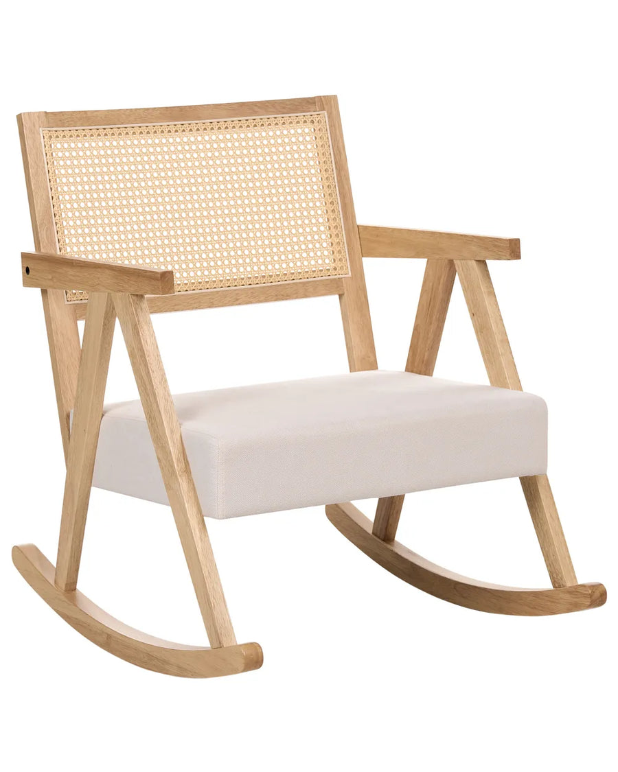 Wooden rocking chair with wicker backrest and white cushion on a white background