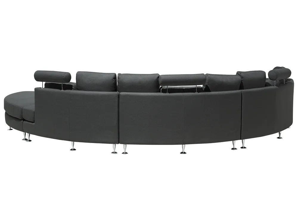 Black curved sectional sofa on a white background