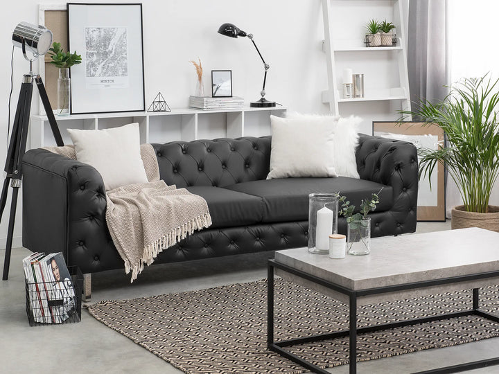 Black faux leather sofa with modern design