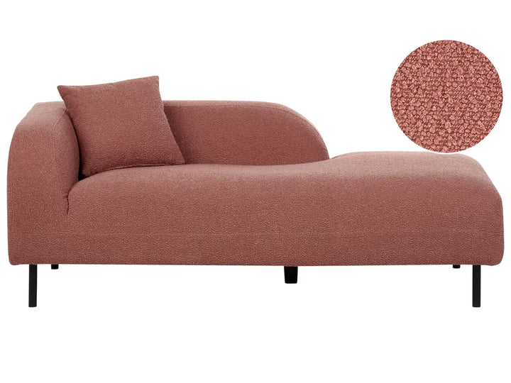 A modern chaise lounge sofa upholstered in a textured terracotta fabric, featuring a matching throw pillow and slim black legs, shown against a plain white background with a circular fabric detail inset in the top right.