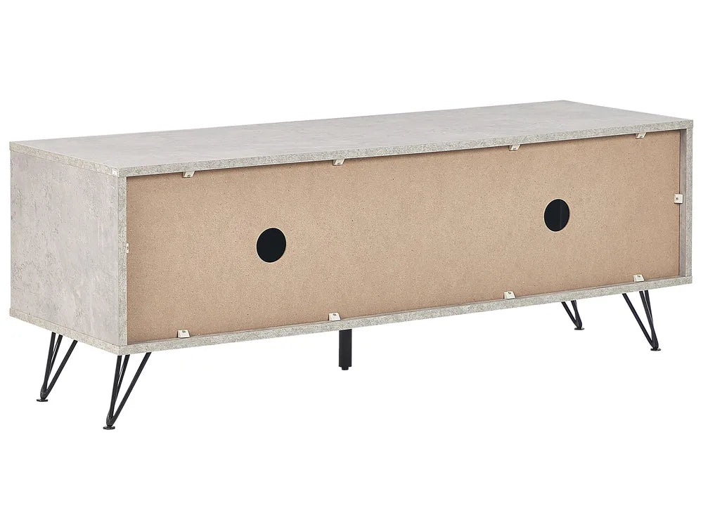 A modern low-profile media console or storage cabinet with a textured light gray concrete-look top and sides, a tan interior panel with two circular cutouts, and black hairpin legs, shown on a plain white background.
