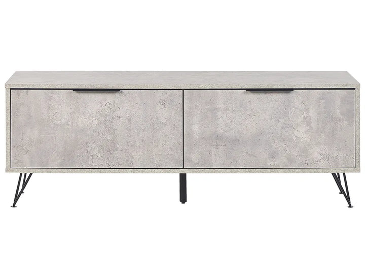 A modern sideboard or media console with a textured light gray concrete-look finish, featuring two front drawers with slim black handles and four black metal hairpin legs, shown against a plain white background.