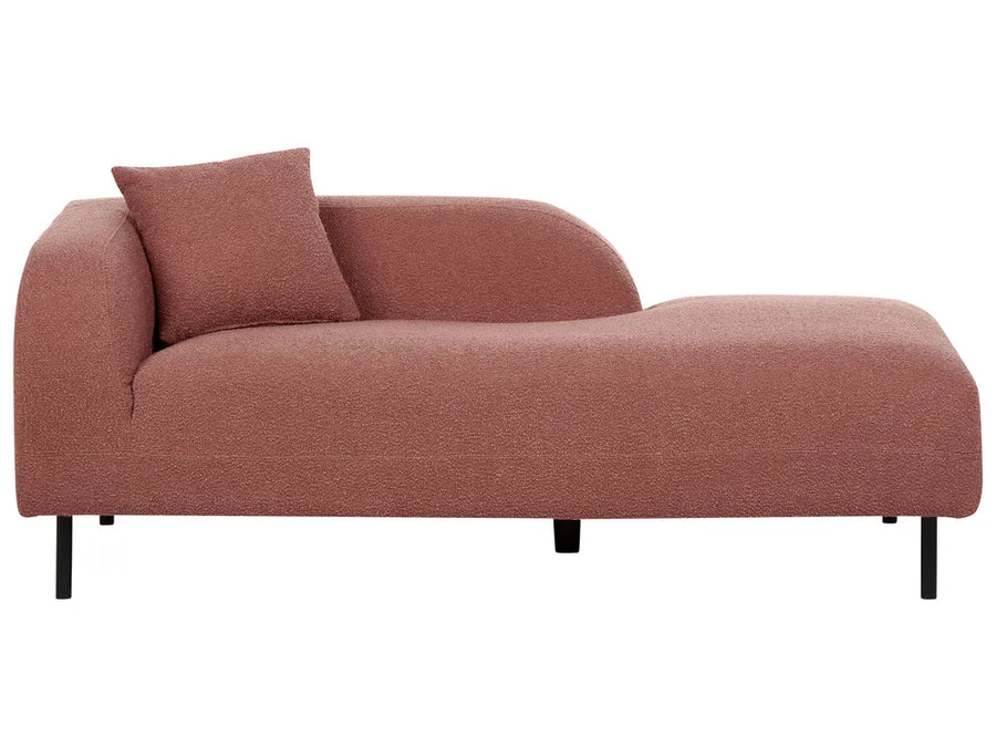 A modern chaise lounge sofa upholstered in a textured dusty rose bouclé fabric, featuring a matching throw pillow and slim black metal legs, shown against a plain white background.