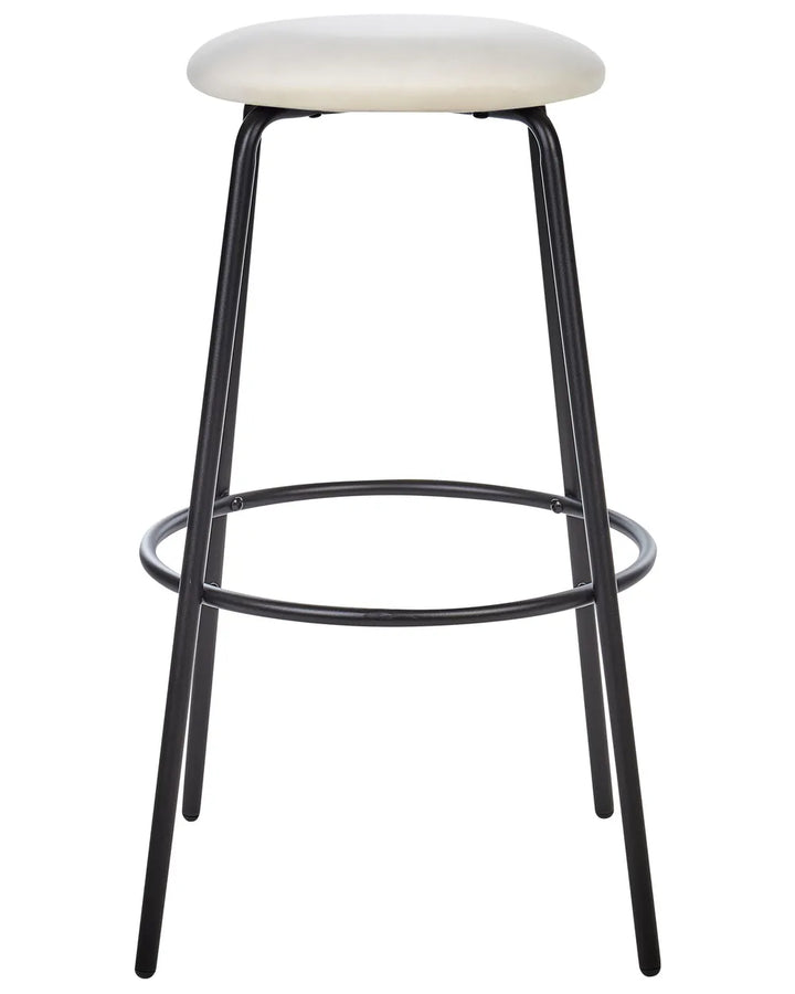 A modern bar stool with a round cream upholstered seat and a black metal frame featuring four legs and a circular footrest ring, shown against a plain white background.