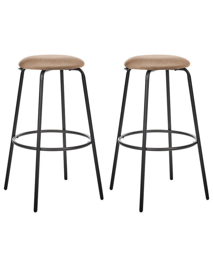 Two matching bar stools with round tan upholstered seats and black metal legs, shown on a plain white background.