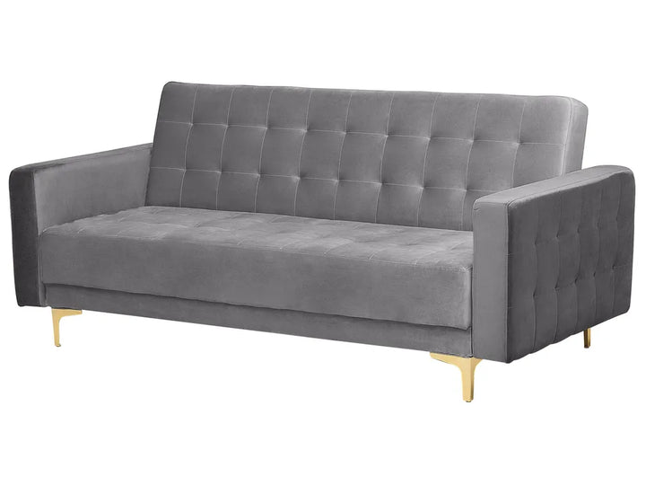 A modern gray velvet loveseat sofa with a tufted button design on the backrest and seat, supported by slim gold metal legs, shown against a plain white background.