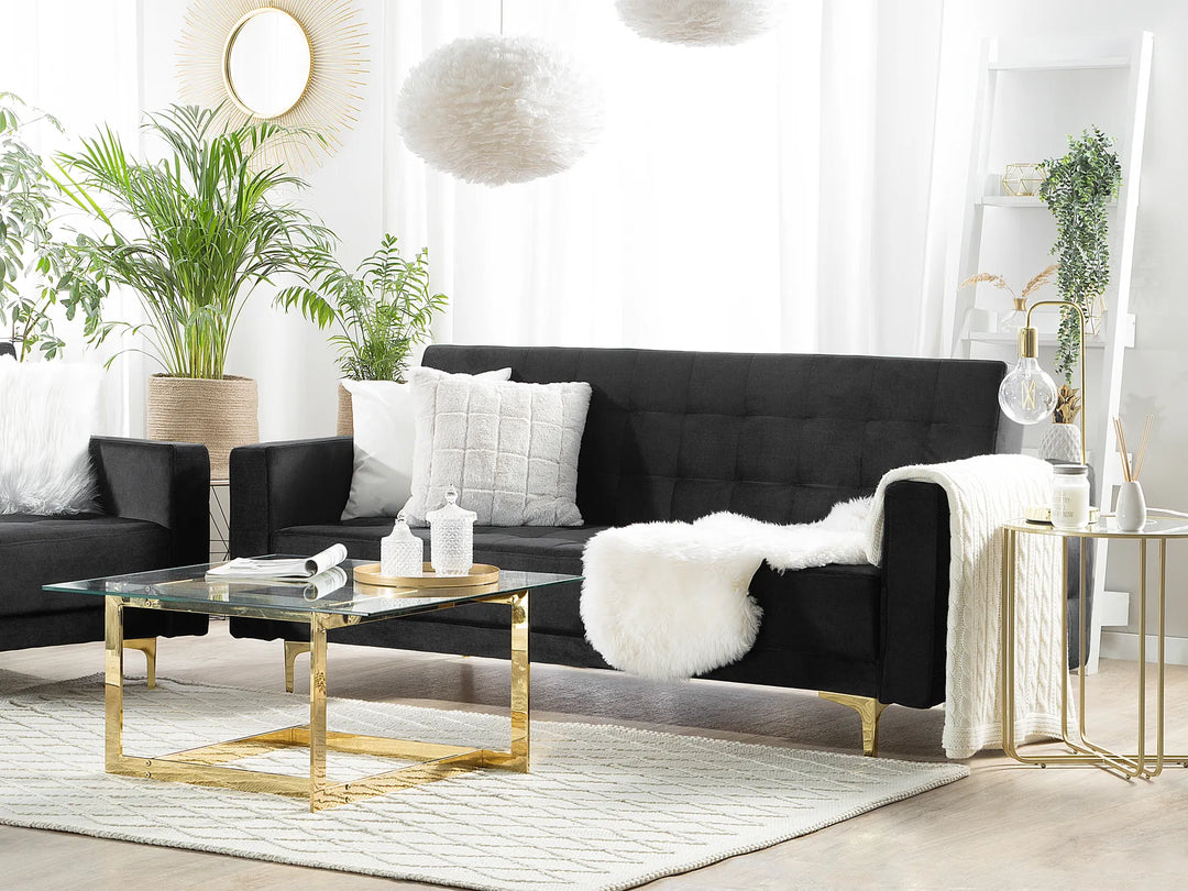 Black velvet sofa bed with gold legs