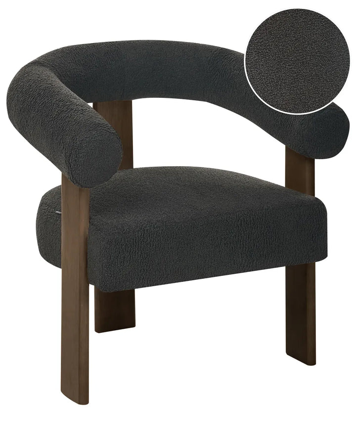 A modern accent chair with a curved dark gray bouclé upholstered seat and backrest, supported by dark brown wooden legs, featuring a circular inset showing a close-up of the textured bouclé fabric.