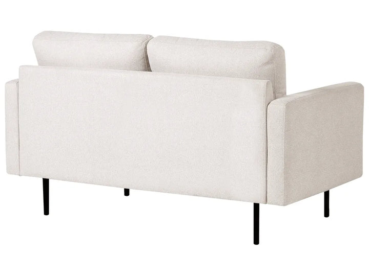 A modern two-seater sofa in a light beige textured fabric, featuring black metal legs, shown from a three-quarters angle against a plain white background.