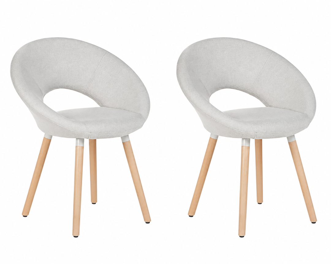 Two modern upholstered dining chairs with light gray fabric seats and natural wood legs, shown side by side on a white background.