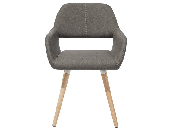 A modern upholstered dining chair with a gray fabric seat and backrest, featuring integrated armrests and light natural wood legs, shown against a plain white background.