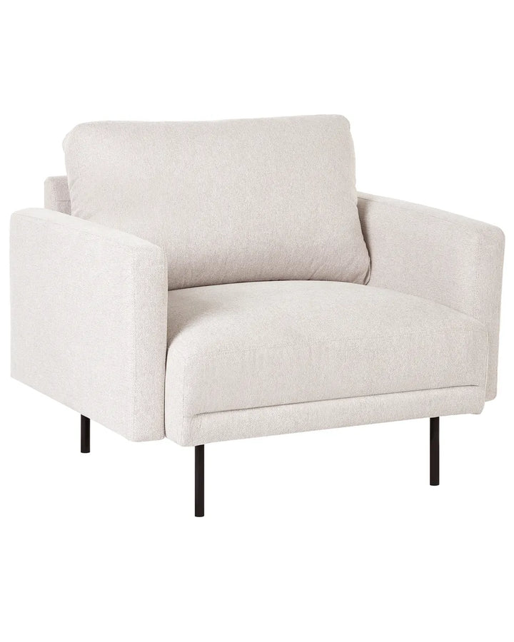 A modern low-profile armchair upholstered in a textured cream or off-white fabric, supported by slim black metal legs, shown against a plain white background.