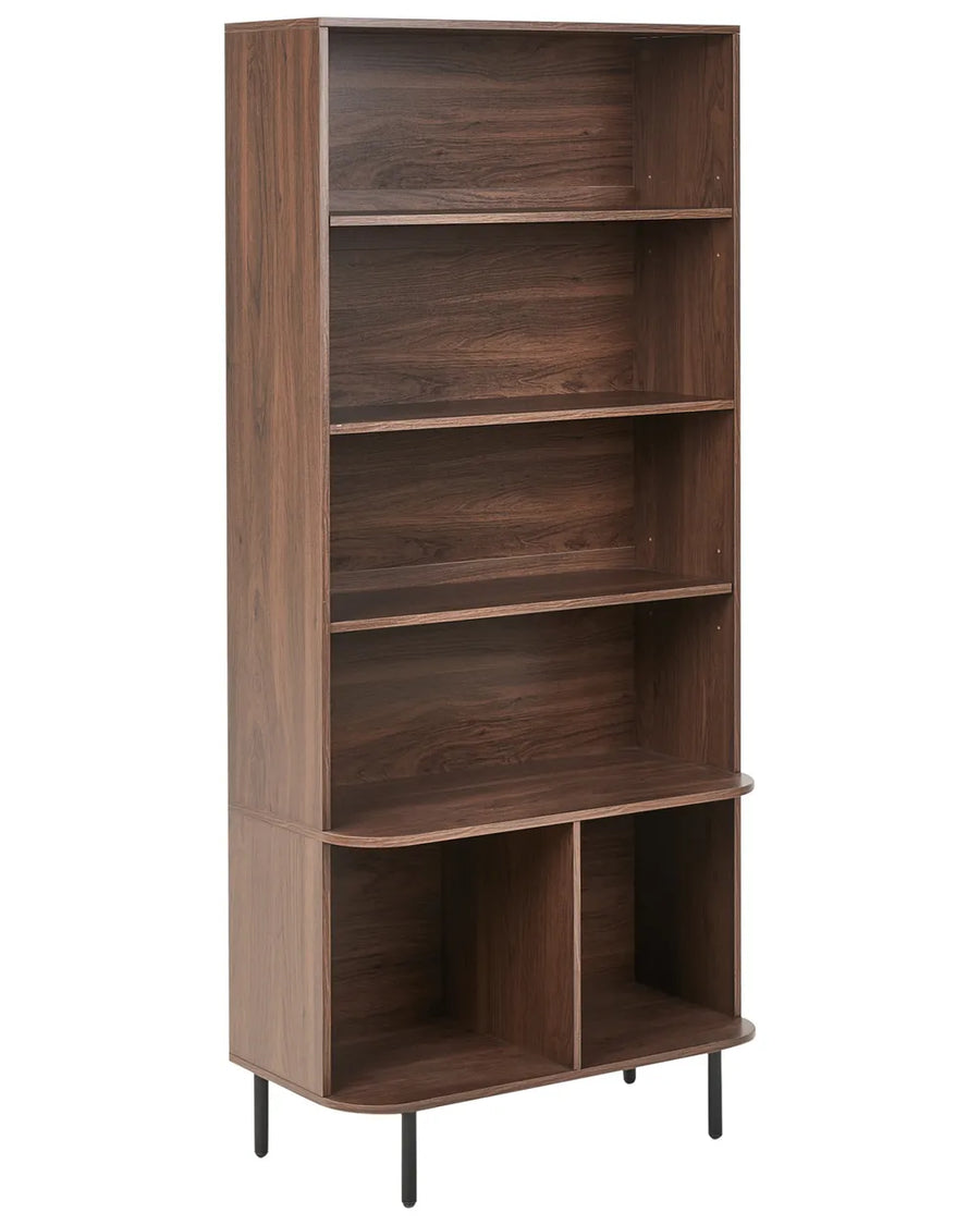 A tall, narrow bookcase with a dark brown wood grain finish, featuring five open shelves and two lower storage cubbies on a white background.