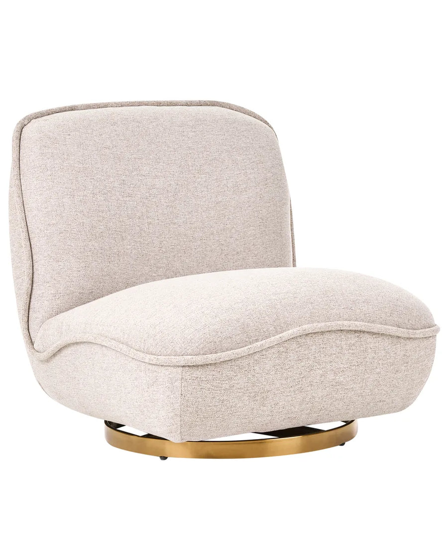 A modern low-profile accent chair upholstered in a textured light beige fabric, featuring a curved backrest and a round polished gold metal swivel base, shown against a solid white background.
