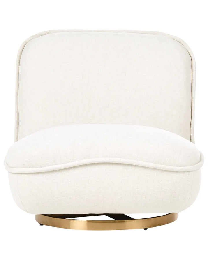 An off-white upholstered swivel armchair with a curved backrest and a round brushed brass metal base, shown against a solid white background.