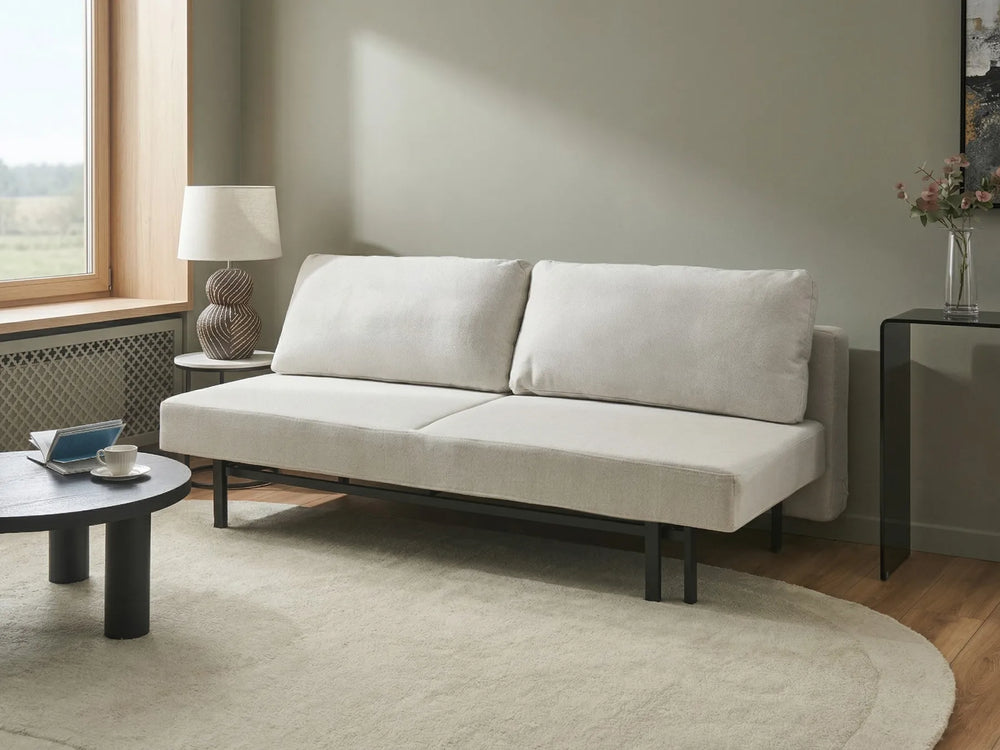 Modern off-white sofa bed with cushioned seats