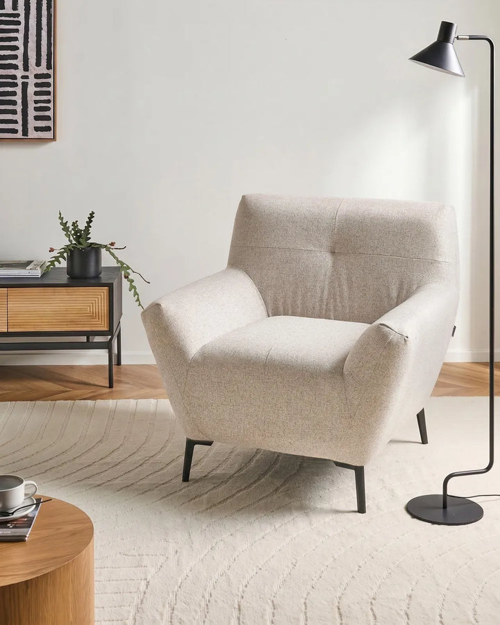 Modern beige fabric armchair