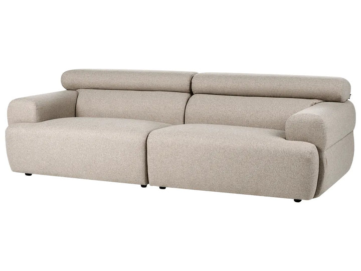 Comfortable beige three-seater sofa