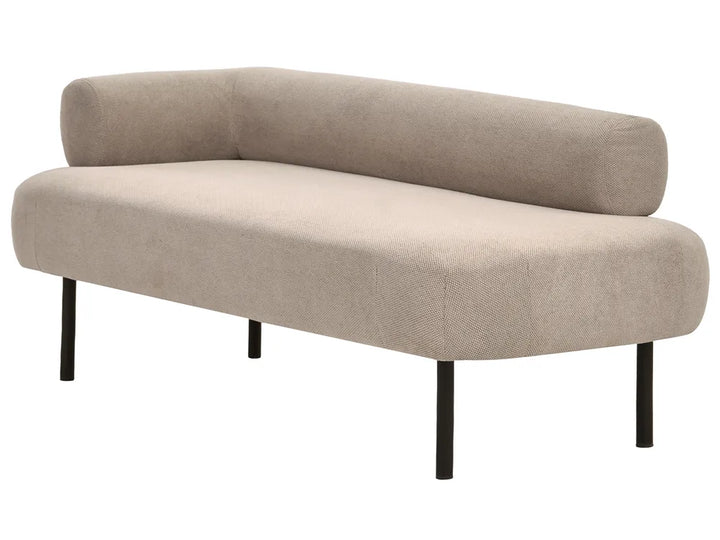 A modern L-shaped corner sofa in a textured light beige fabric, supported by slim black metal legs, shown against a plain white background.