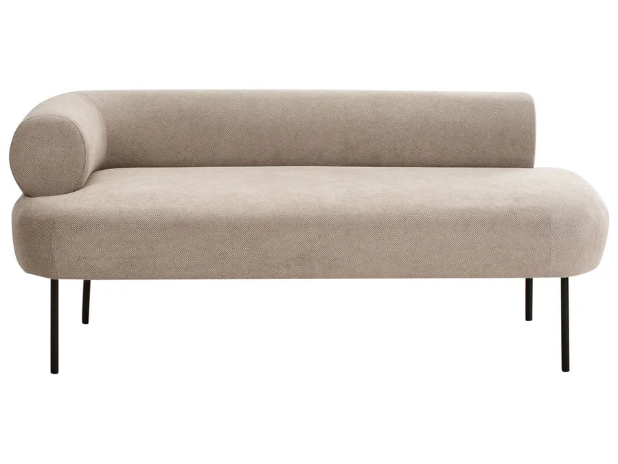 A modern curved daybed with a light beige textured fabric upholstery and slim black metal legs, shown against a plain white background.