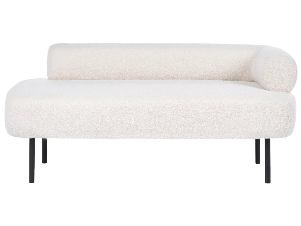 A modern low-profile daybed with a textured cream bouclé upholstery and slim black metal legs, shown against a plain white background.