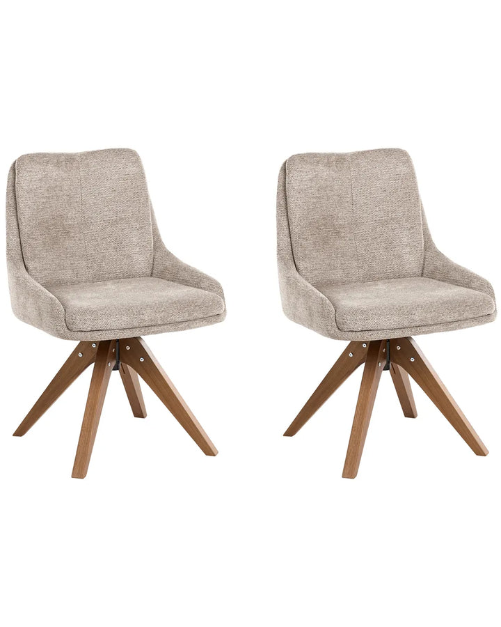 Two matching upholstered swivel dining chairs with light beige textured fabric seats and wooden star-style legs, shown on a plain white background.