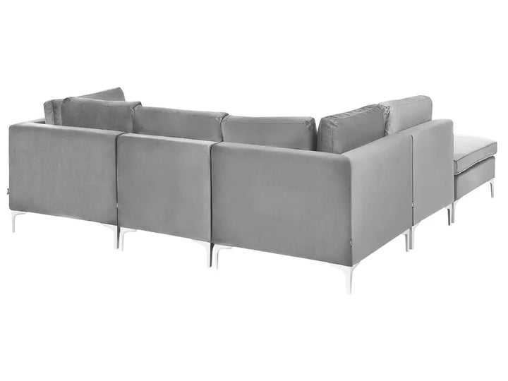 A modern light gray fabric sectional sofa with a chaise lounge on the right side, supported by slim silver metal legs, shown against a plain white background.