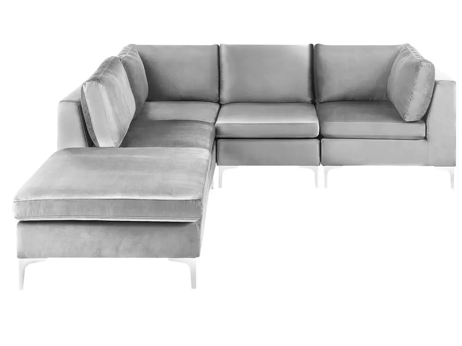 A modern light gray sectional sofa with a left-facing chaise lounge and slim white legs, shown against a plain white background.