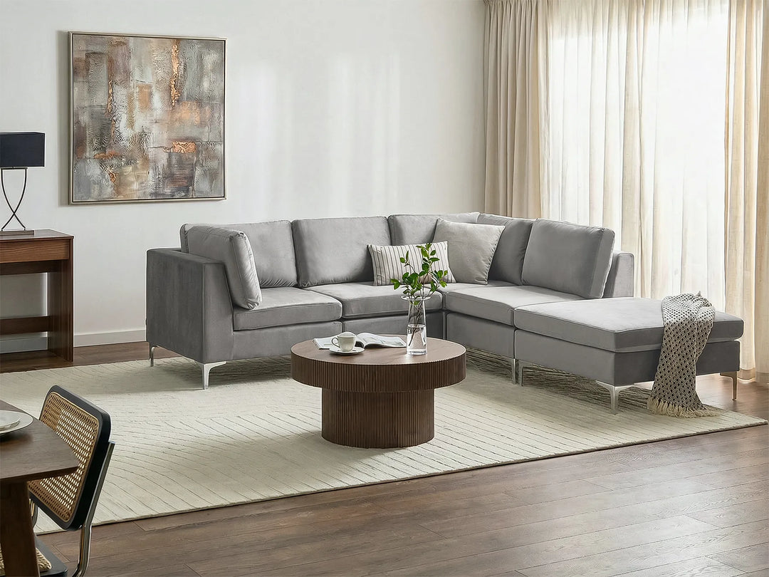 Grey velvet sofa with ottoman