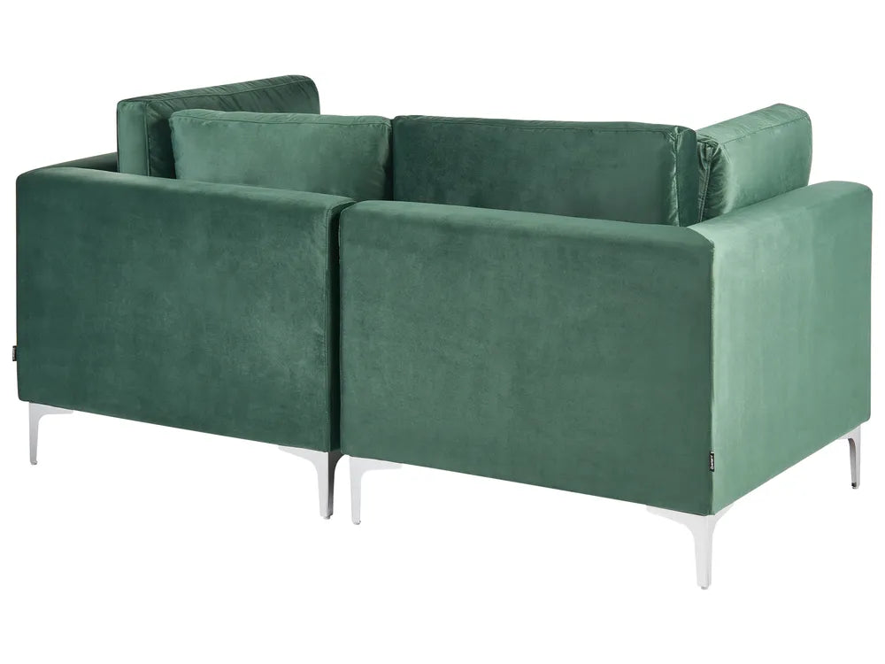 Green modular sofa with plush velvet upholstery
