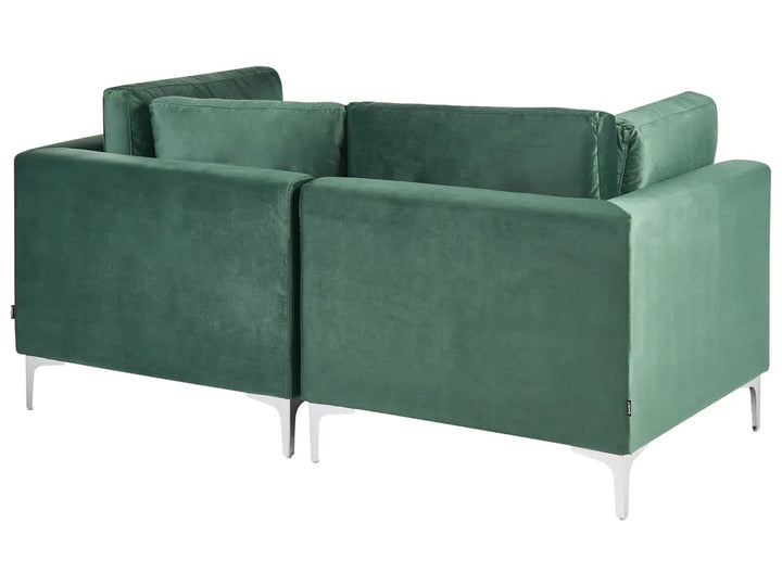 Green modular sofa with plush velvet upholstery