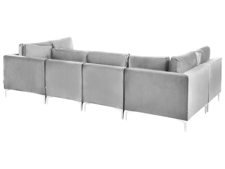 A light gray modular fabric sectional sofa with slim silver metal legs, shown from a three-quarters angle against a solid white background.