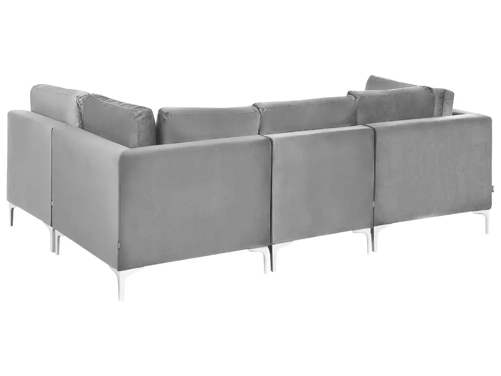 A modern modular sectional sofa upholstered in light gray fabric, featuring slim silver metal legs, shown from a three-quarters angle against a plain white background.