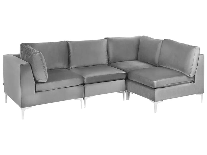 A modern gray upholstered sectional sofa with a right-facing chaise lounge and slim white metal legs, shown against a plain white background.