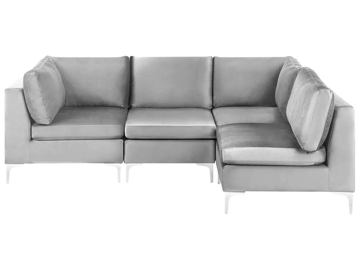 A modern light gray sectional sofa with a right-facing chaise lounge and slim white legs, shown against a plain white background.