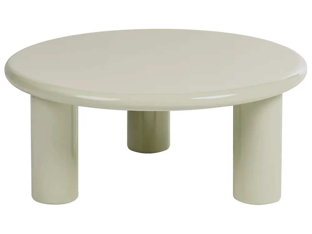 A minimalist round low table with thick cylindrical legs in a glossy off-white finish, isolated on a white background.