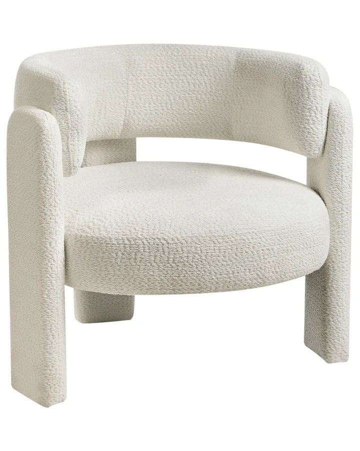 A modern low-profile accent chair upholstered in a textured bouclé fabric in off-white, featuring a rounded backrest, integrated armrests, and blocky legs on a plain white background.