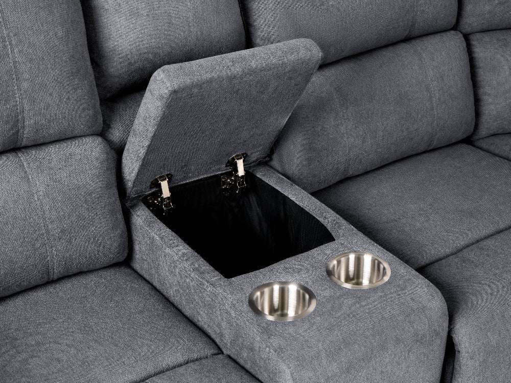 Close-up of a gray upholstered sectional sofa armrest with a lift-up storage compartment and two stainless steel cup holders.