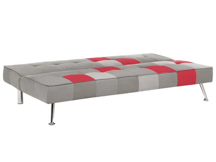 A modern tufted daybed with a gray and red patchwork design, supported by slim chrome legs, shown against a plain white background.