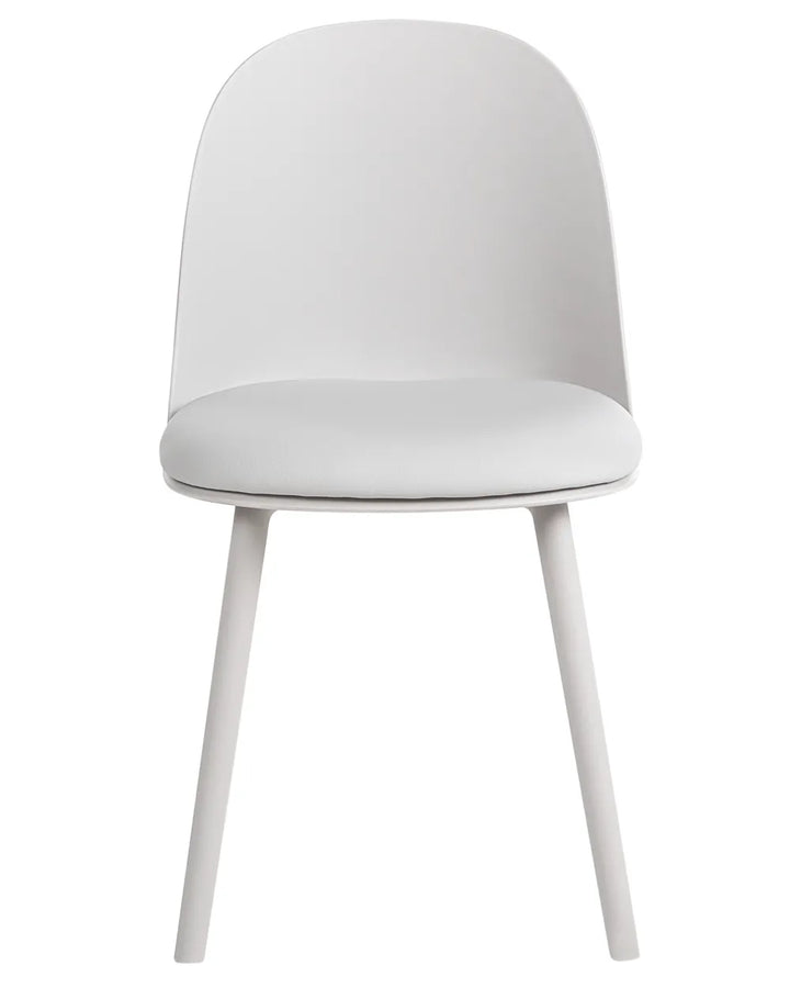 A modern white dining chair with a curved backrest, cushioned seat, and tapered legs, shown against a plain white background.