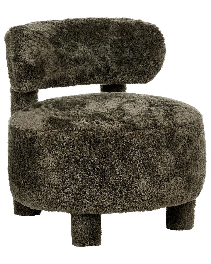 A round, low-profile armchair upholstered in dark brown shaggy faux fur, featuring a curved backrest and short legs, shown against a plain white background.