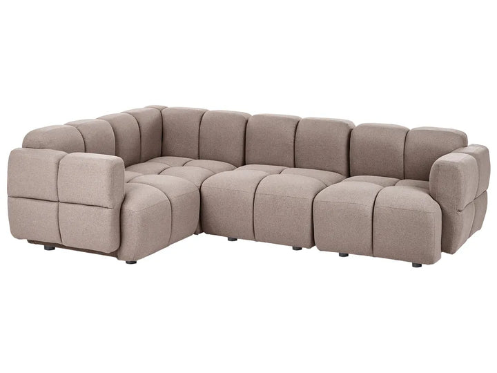 A modular sectional sofa upholstered in a textured taupe fabric, featuring a tufted grid pattern and blocky, modern armrests, shown against a plain white background.