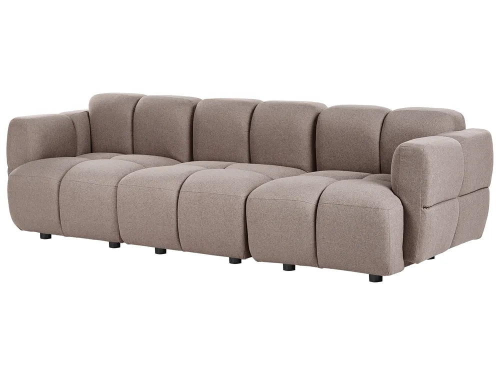 A modern modular sectional sofa upholstered in a textured taupe fabric, featuring a tufted grid pattern and low black legs, shown against a plain white background.