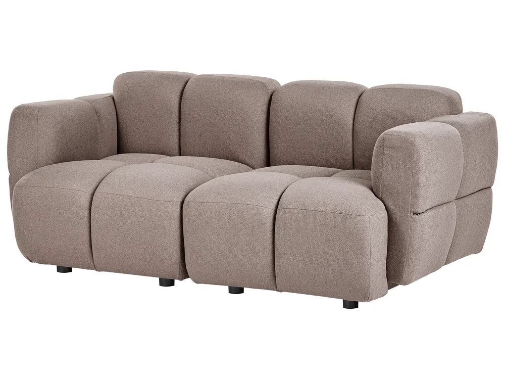 A modern modular upholstered sofa in a taupe-beige fabric, featuring a segmented, bubble-like design with low-profile arms and small black feet, shown against a plain white background.